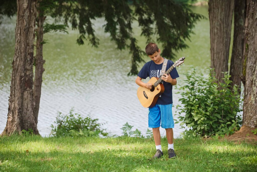 Camper playing a guitar